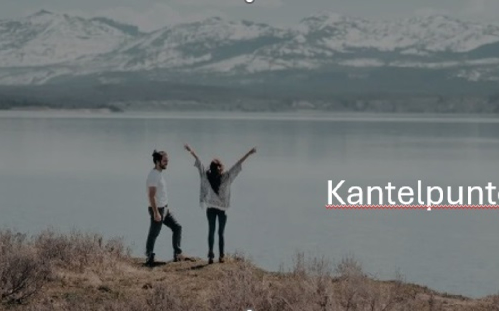 2 people near a lake
