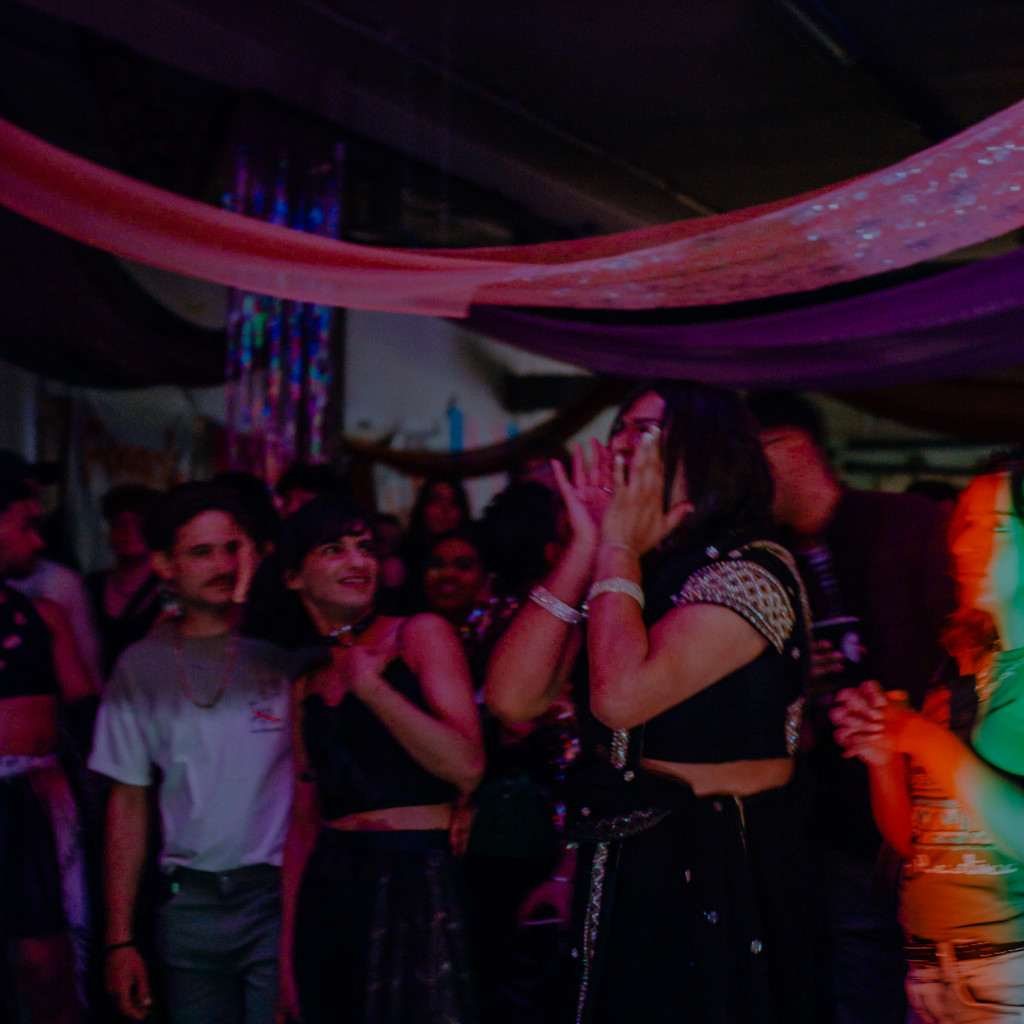 a blur of people in colourful, clashing clothes.