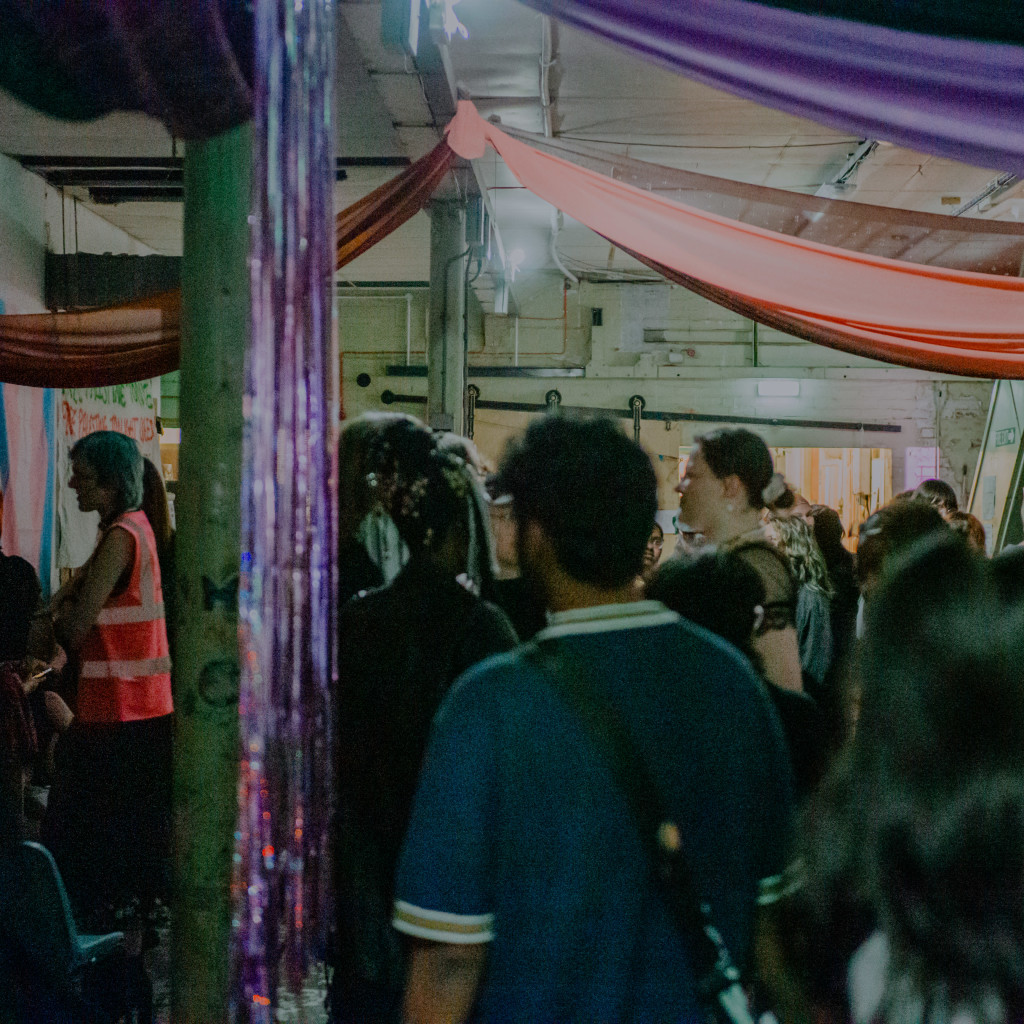 a blur of people in colourful, clashing clothes.