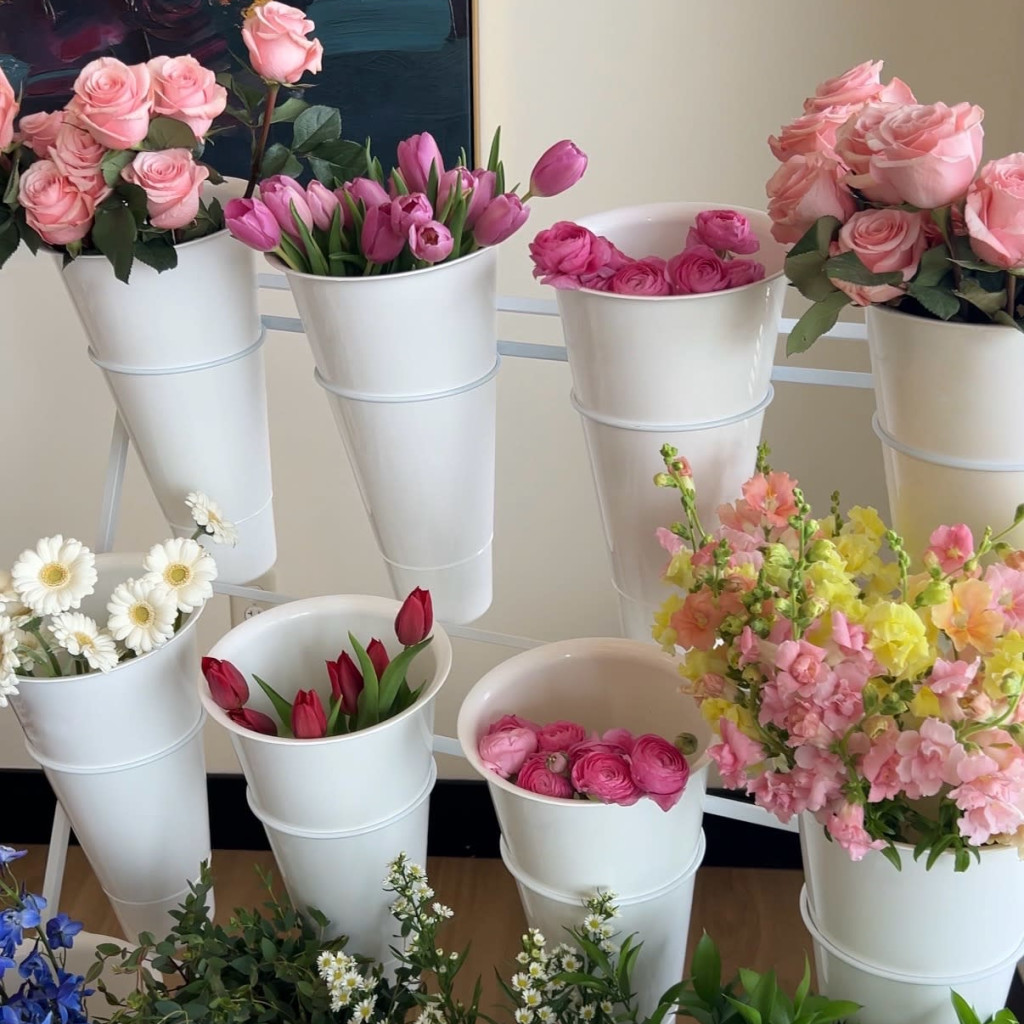 people painting vases with acrylic