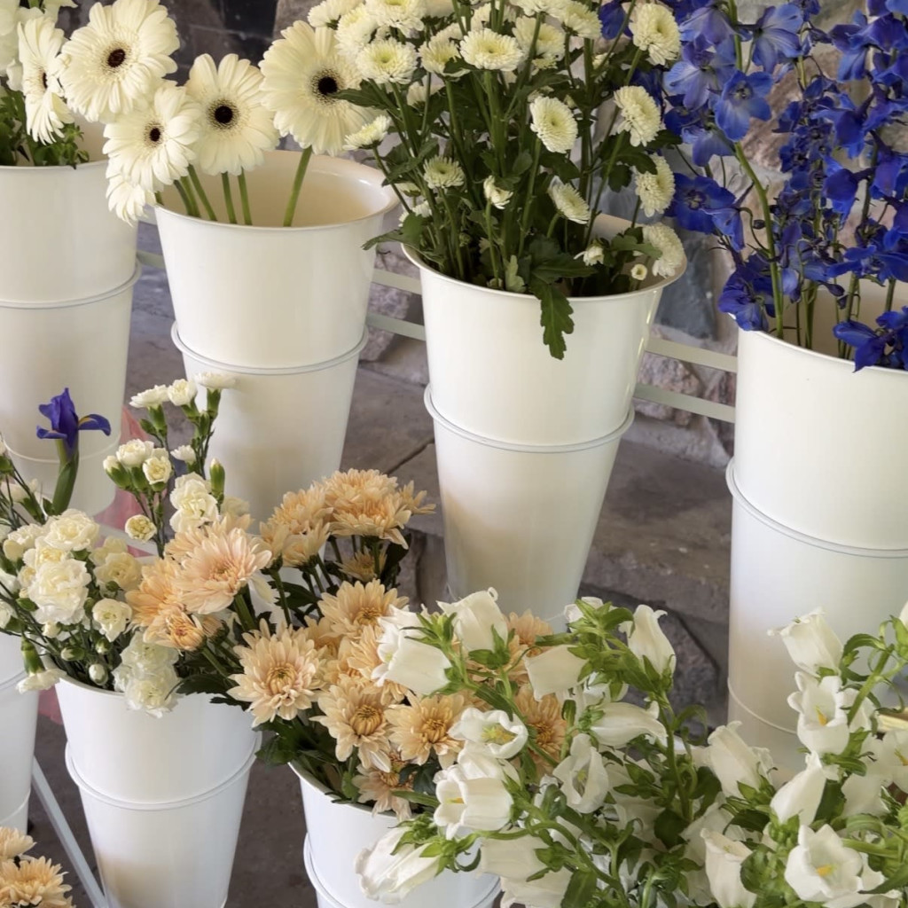 people painting vases with acrylic