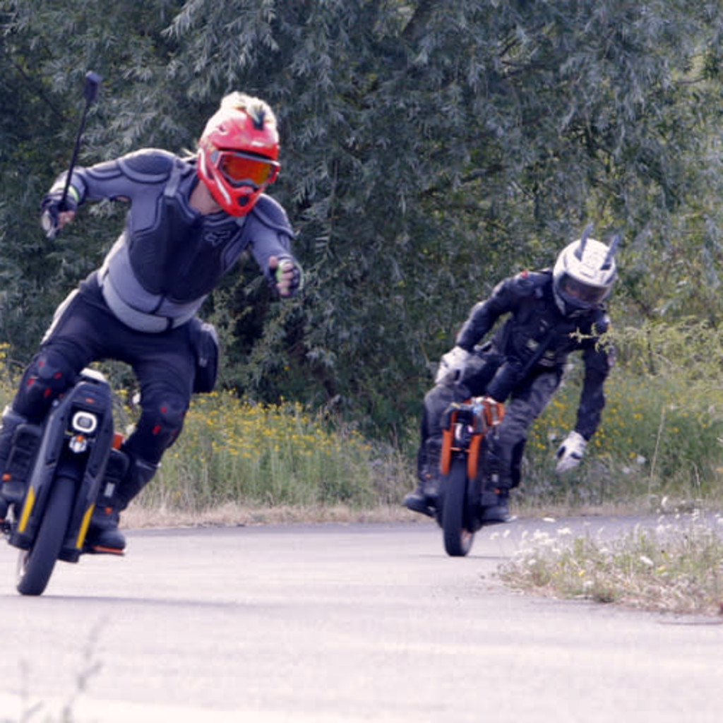 Group of Personal Electric Vehicle Riders Ride Out Ebike Esk8