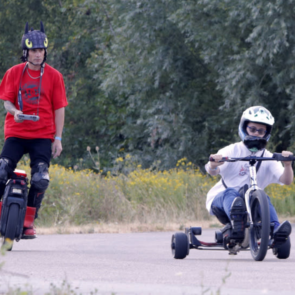 Group of Personal Electric Vehicle Riders Ride Out Ebike Esk8