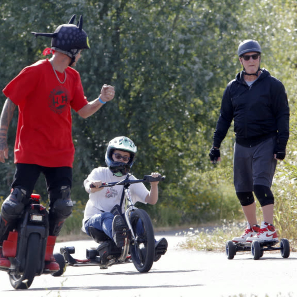 Group of Personal Electric Vehicle Riders Ride Out Ebike Esk8