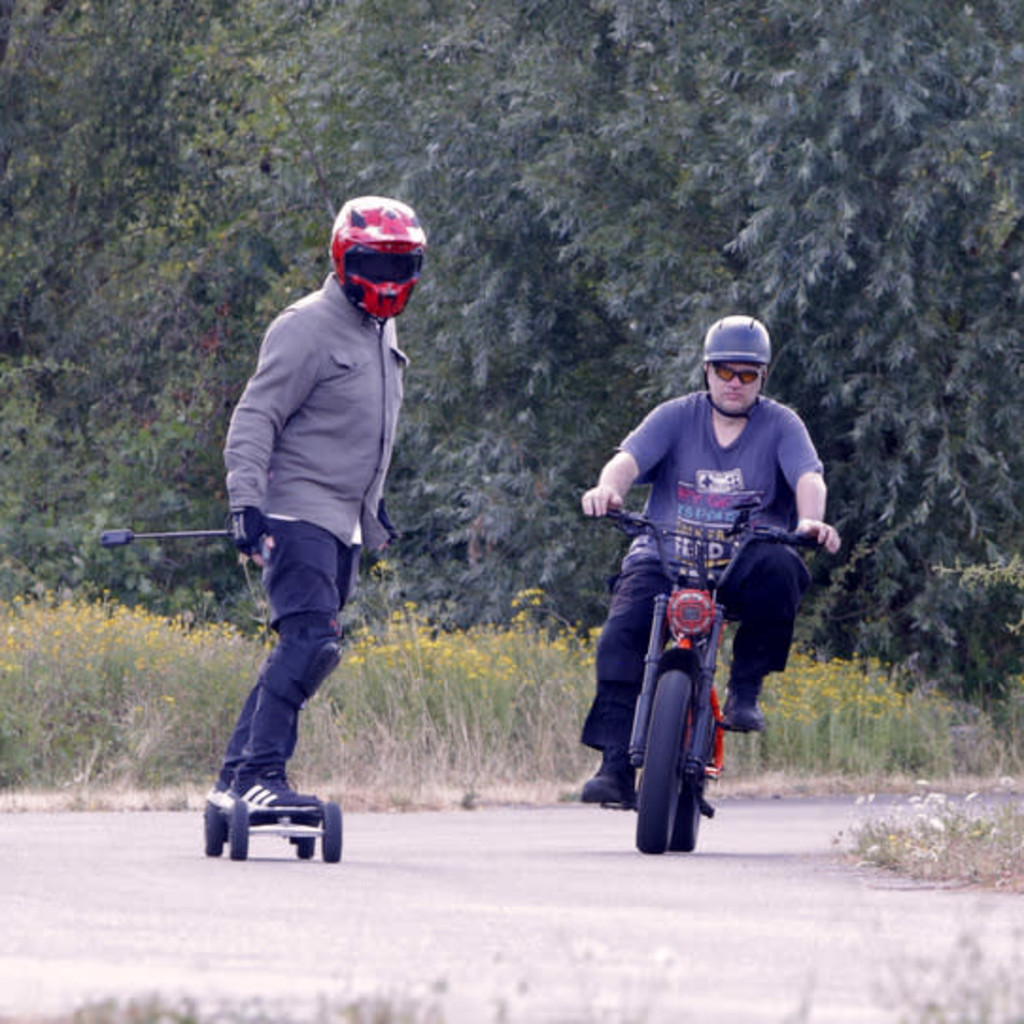 Group of Personal Electric Vehicle Riders Ride Out Ebike Esk8