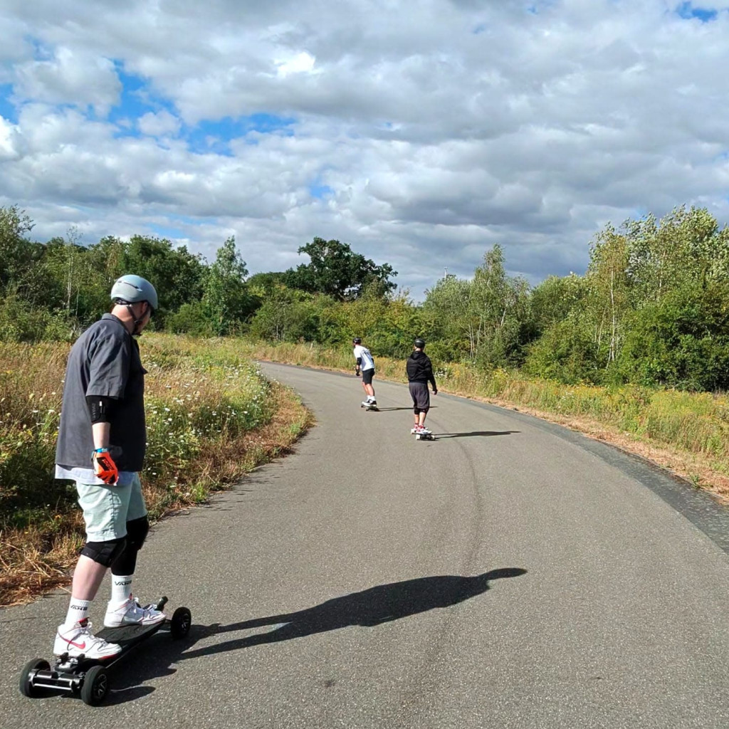 Group of Personal Electric Vehicle Riders Ride Out Ebike Esk8