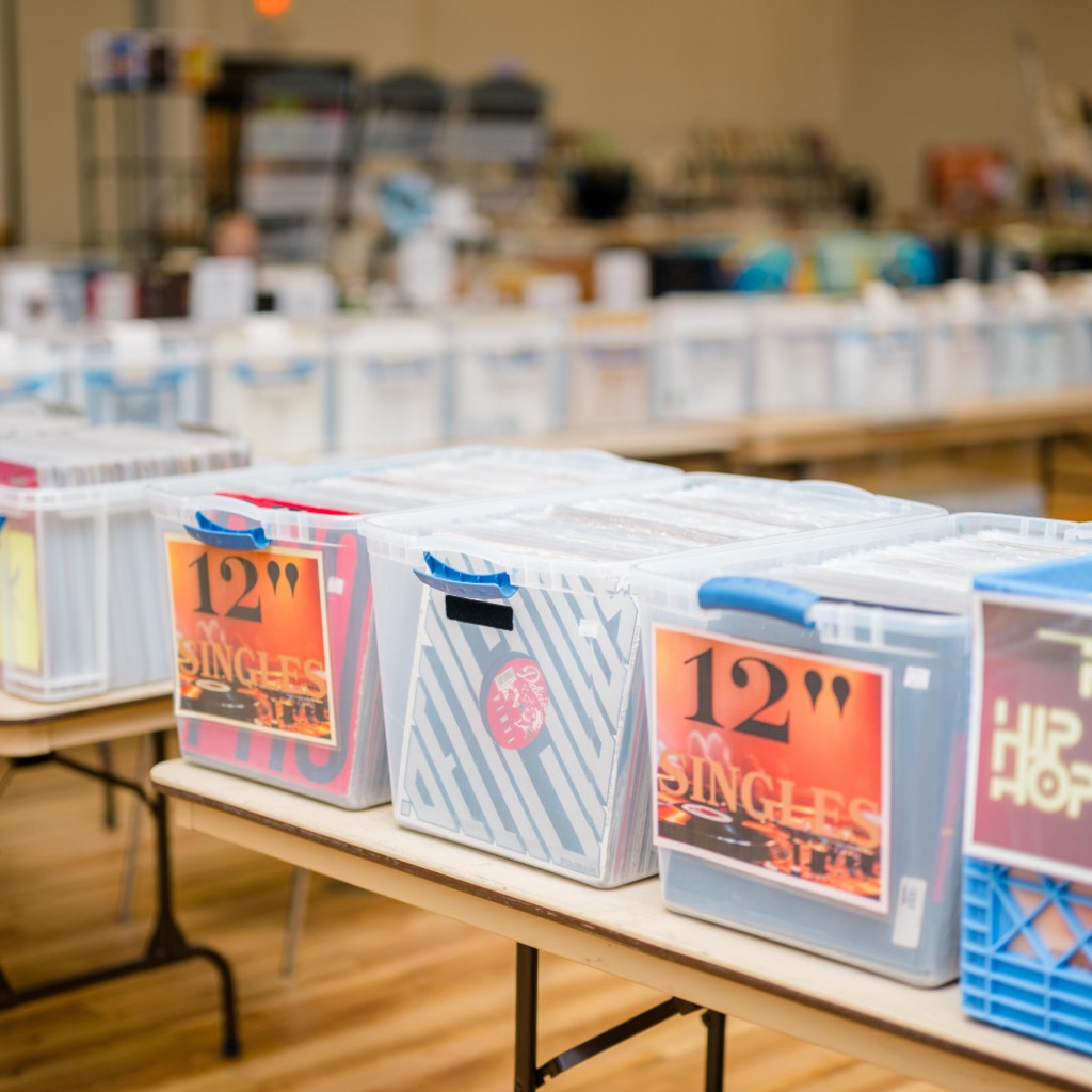 Someone crate digging through records