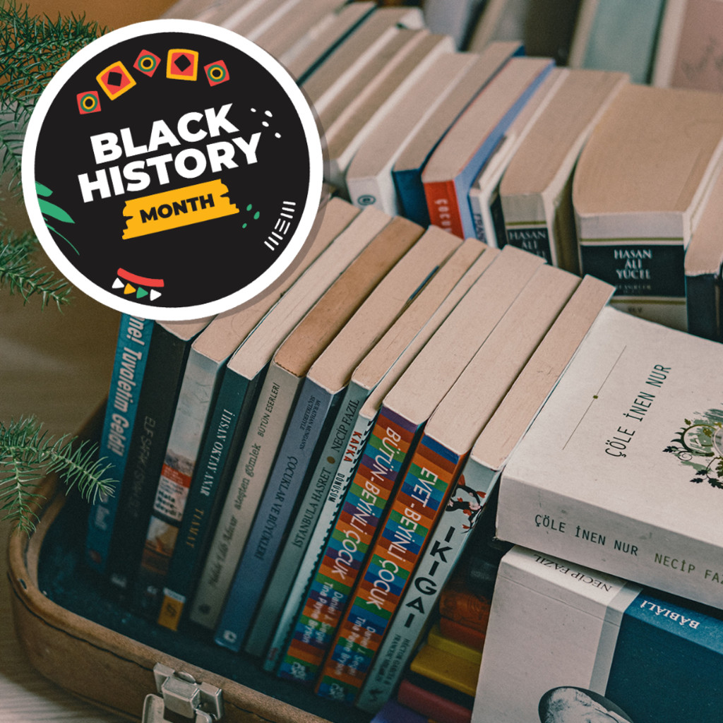 A plie of books in various shapes, sizes and colours with a black sticker saying "Black History Month"