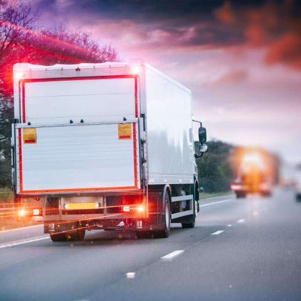 A white unmarked truck heading down the motorway after just completing their Driver CPC Return to Driver Course with Verrdi Transport Consultancy