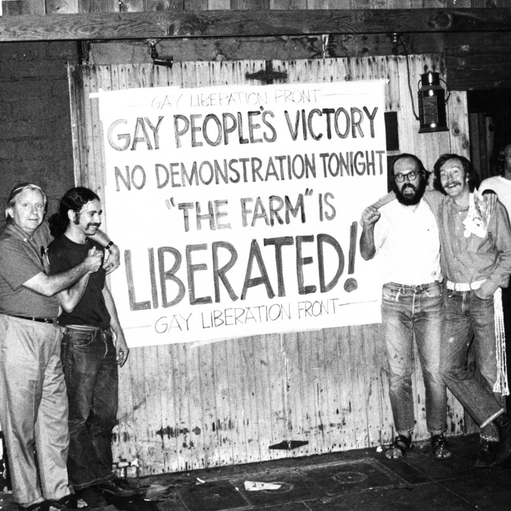 Gay Liberation Front members, including Morris Kight (far left)and Don Kilhefner(third from right), celebrate outside the Farm in West Hollywood after forcing the owner to rescind the no-touching rule