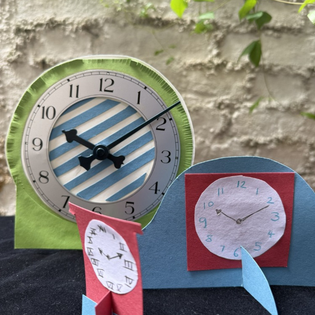 Image shows a group of homemade clocks