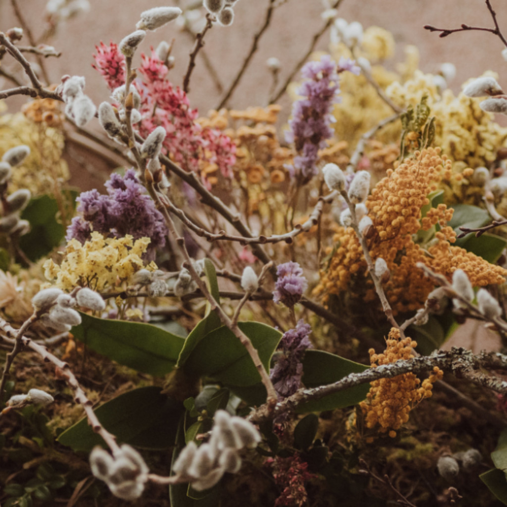 Wildflowers and twigs gathered together.