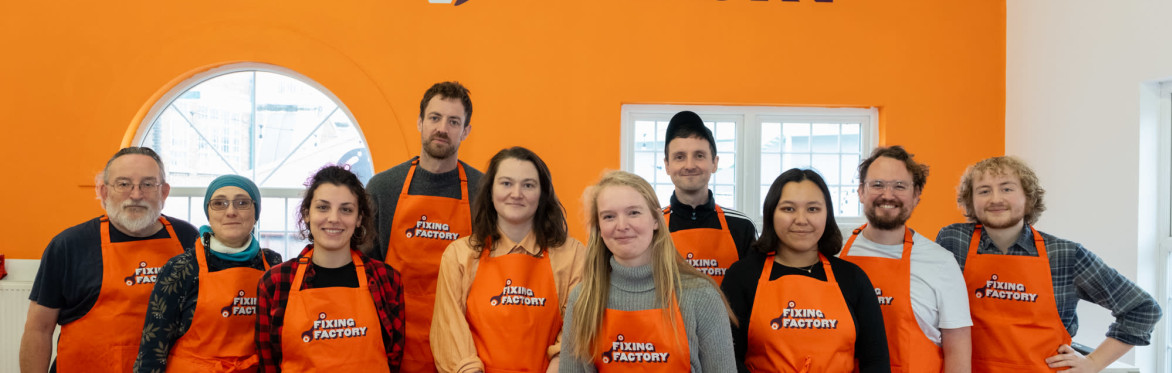 group of Fixing Factory team smiling at camera