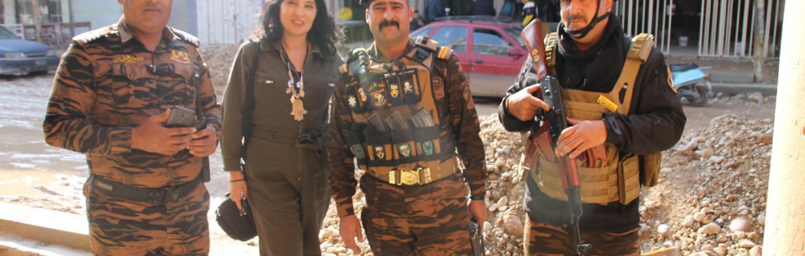 Hadani with Iraqi army escort in Mosul's Christian quarter 2019 before it was completely demined
