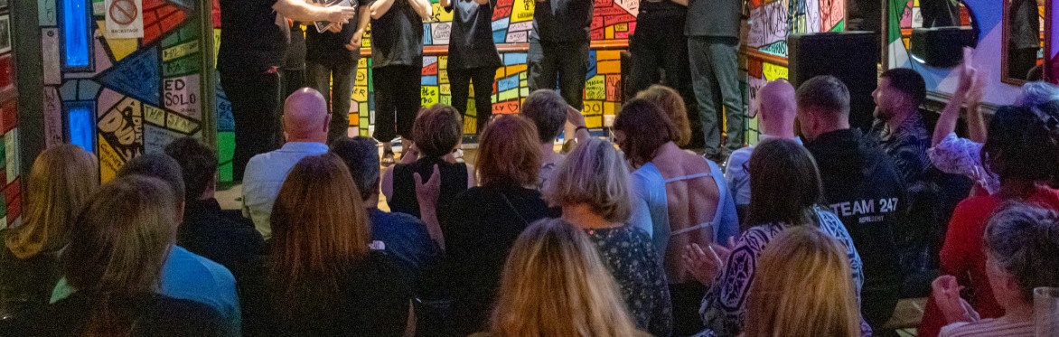 A crowd watching South Wales Improv Comedy