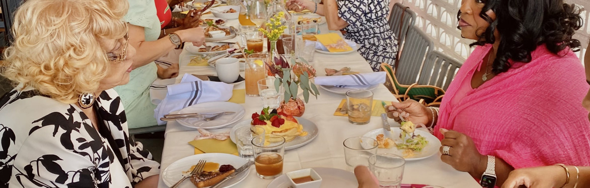 women at long brunch table