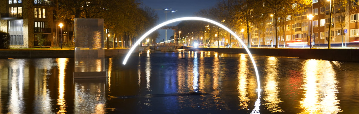 People interacting with a fun light art installation