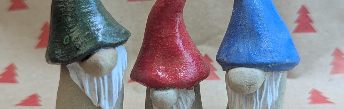 a trio of ceramic gonks