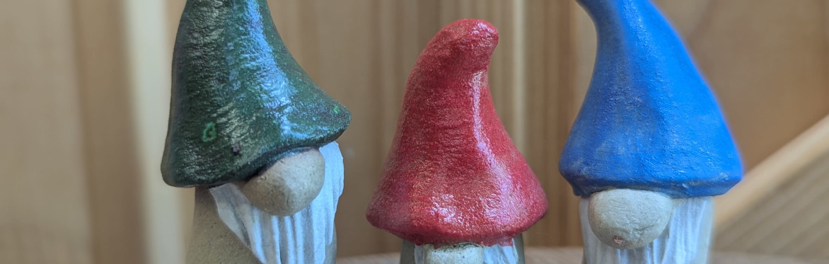 a trio of ceramic gonks