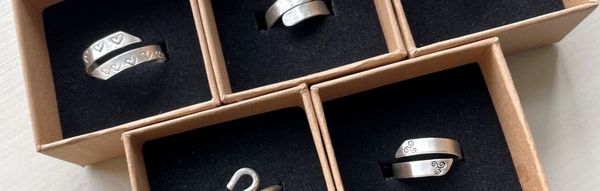 a group of five silver wrap rings