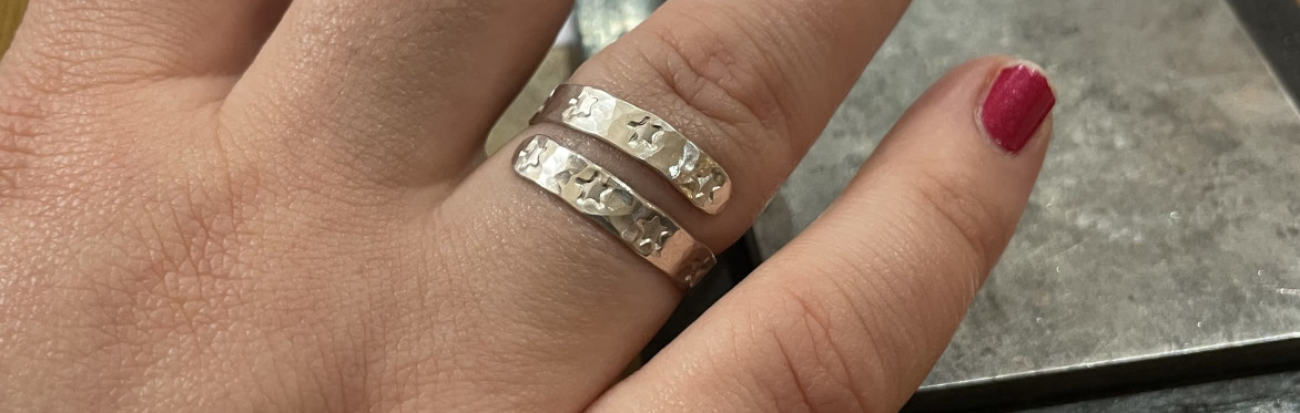 a group of five silver wrap rings