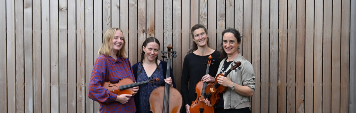 Four women holding string instruments: Grace, Lucy, Miranda, Emma