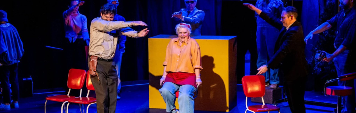 A woman prepares to sing in an improv group shot