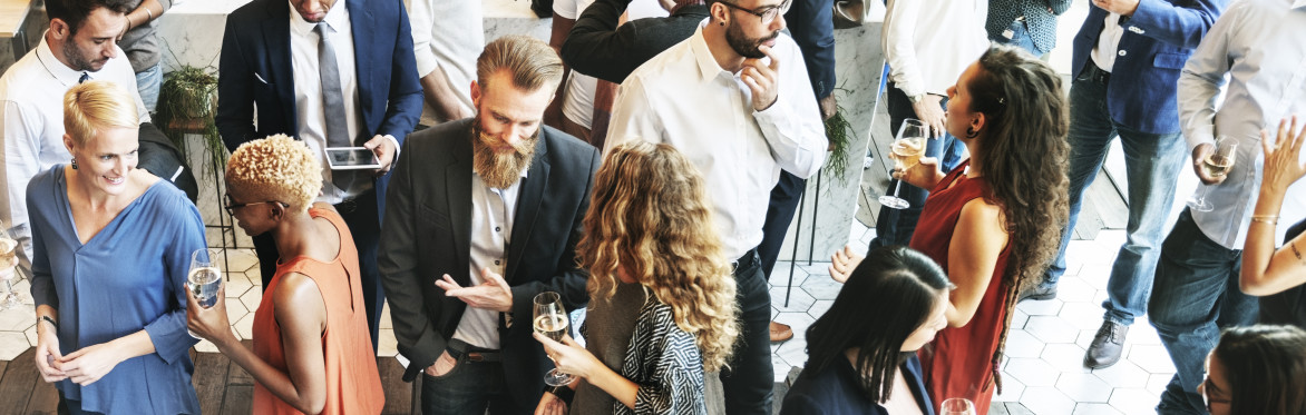 Business people in suits and smart dress mingling with each other