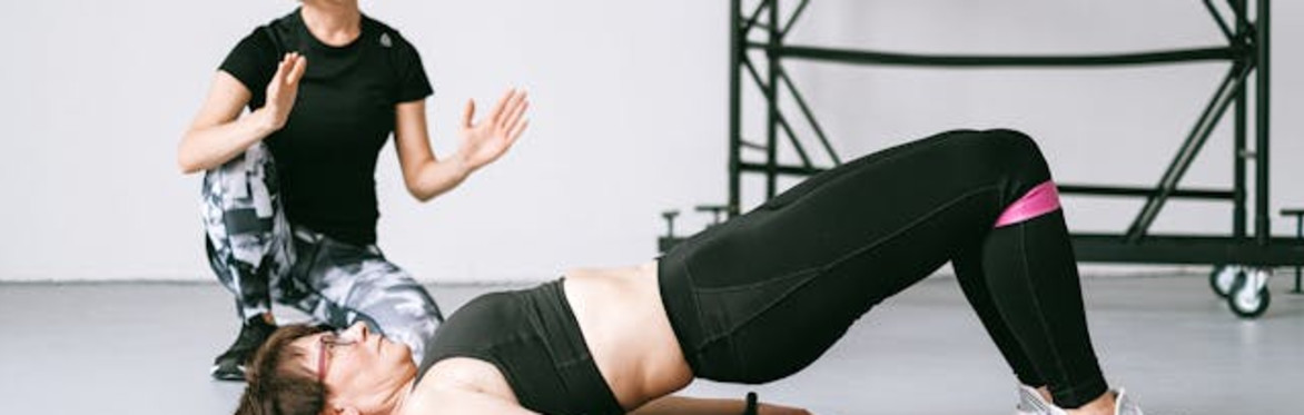 Woman giving exercise advice to another woman
