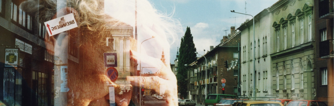 a superimposed colour image of an old man with white hair holding his head in his hand over an a UK street scene of cars and buildings