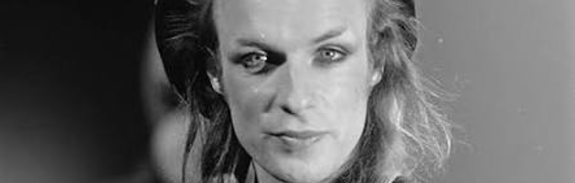 Brian Eno in makeup, looking glam even with thinning hair.