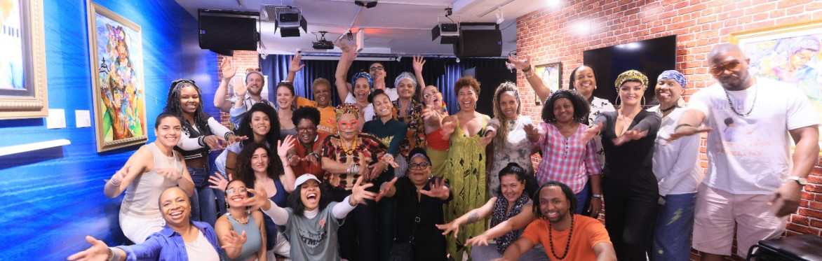A joyful group of participants  posing for a photo after a Rítmicas event