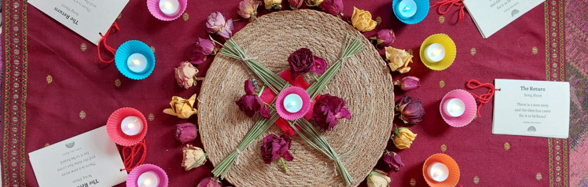 Brigid cross with candles and roses