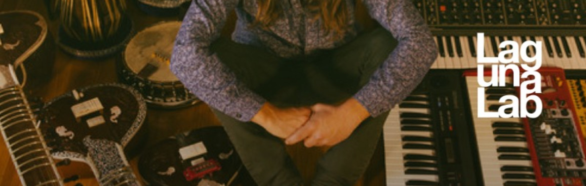 image of a person holding a sitar