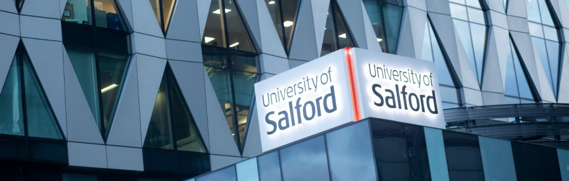 Picture of the Orange Tower, MediaCityUK, on the right and some parts of the building next to it on the left side of the picture