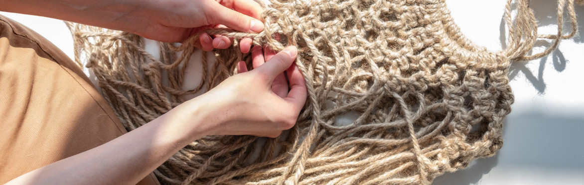 a closeup of a person doing macrame