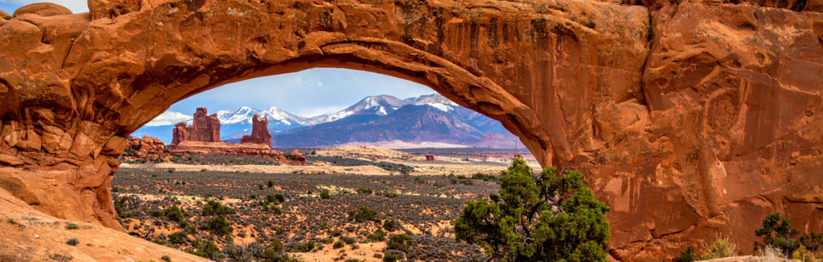 Rock arch showing mountains in the background