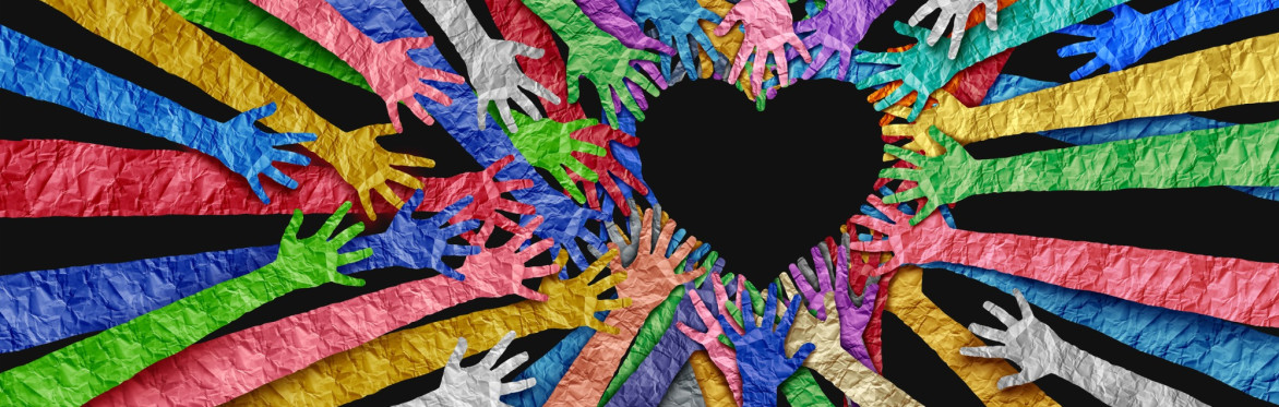 multicoloured hands making the shape of a heart