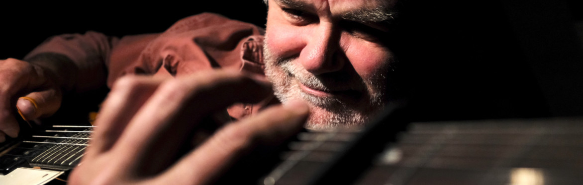 Man playing a guitar