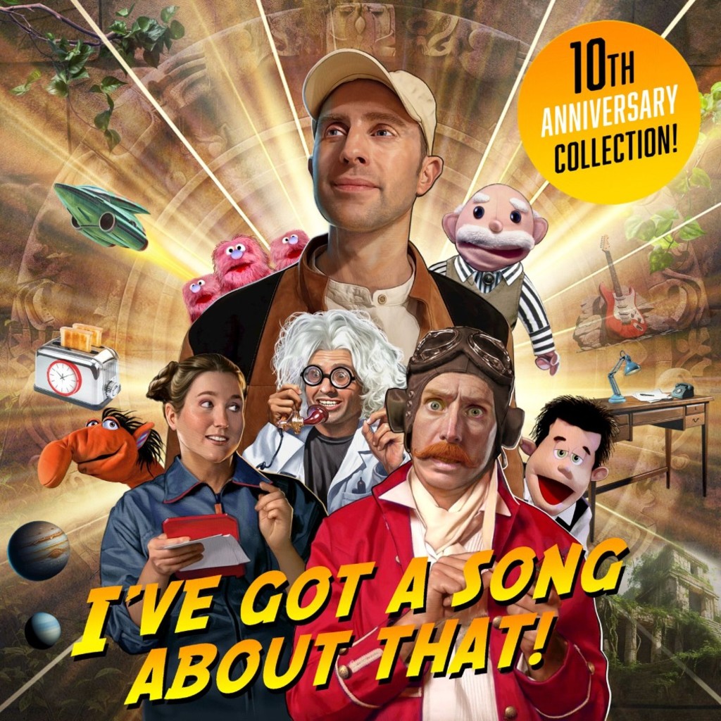 Michael J Tinker, surrounded by characters and puppets from his show, with the caption "10th anniversary collection"