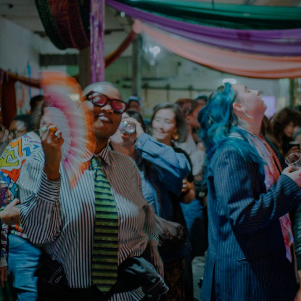 a blur of people in colourful, clashing clothes.