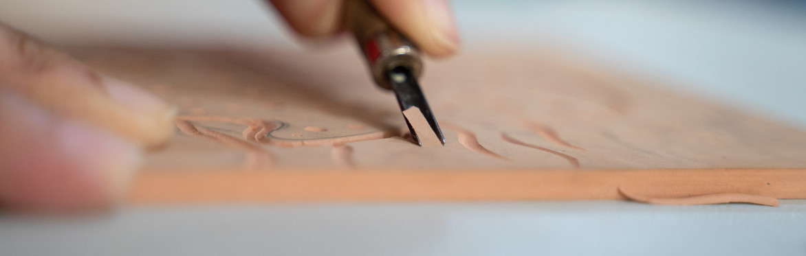 a person doing relief print making