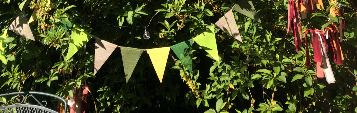 a green bush and bunting