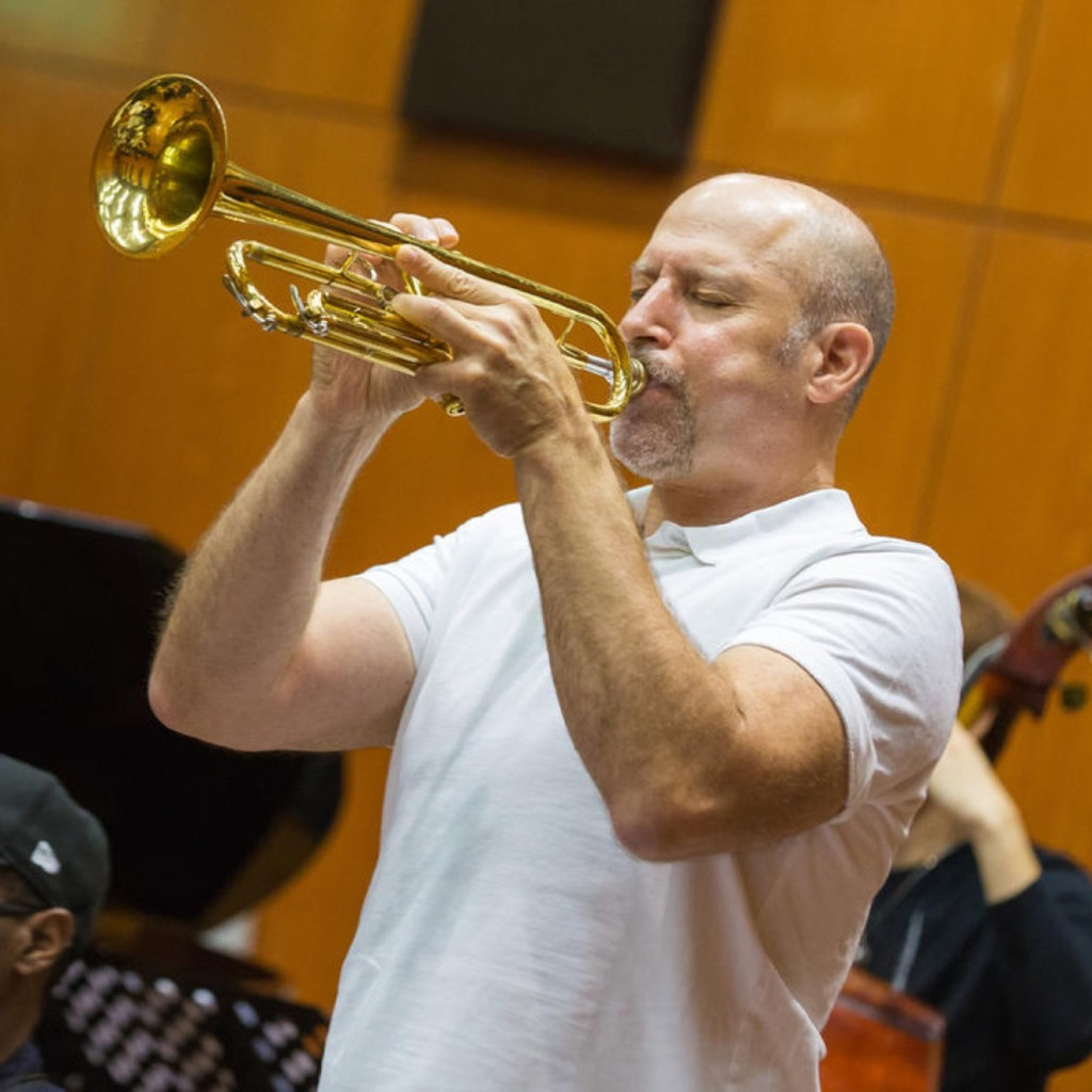 Michael Mossman playing trumpet during a Latin jazz performance