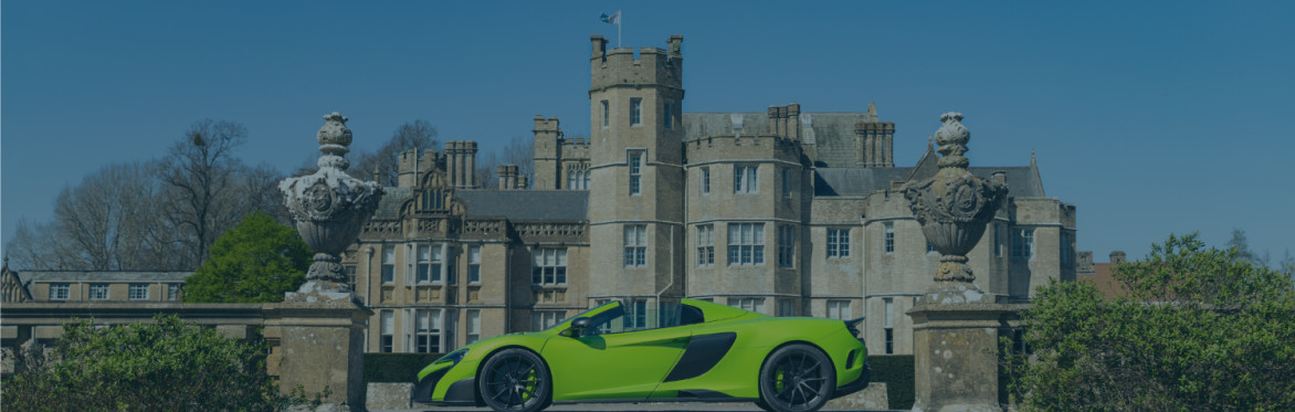 Green McLaren in front of Canford School