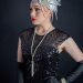 Headpiece with white feather, rhinestones and beautiful chains on the side.