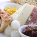 Locally sourced cheeses, thick-cut ham, homemade pork pie.  Chutney, pickles, crisp onions, fresh apple, celery,  crusty roll with butter.  Includes your choice of tea, coffee