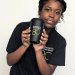 Student holding travel mug