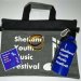 Pack containing bag, flask or TShirt, sticker and two festival bands