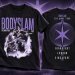 Front and back views of a black Bodyslam tour T-shirt with purple and white graphics.